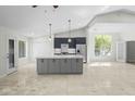 Spacious open-concept kitchen with quartz countertops and stainless steel appliances at 6920 W Via Montoya Dr, Glendale, AZ 85310