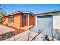 Home featuring a secure gated entryway and an attached garage with a gray door at 7039 N 15Th St, Phoenix, AZ 85020