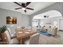 Bright, open living space with modern furniture, archways, and a dining area at 7039 N 15Th St, Phoenix, AZ 85020
