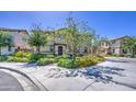 Charming two-story home featuring lush green landscaping, mature trees, and a welcoming entrance at 7412 E Flower Ave, Mesa, AZ 85208