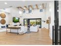 Spacious living room with fireplace, TV, comfortable seating, and an open layout, perfect for relaxation and entertaining at 8245 E Via Del Sol Dr, Scottsdale, AZ 85255