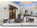 Cozy outdoor patio with comfortable seating, stylish decor, and privacy walls, perfect for relaxing or entertaining guests at 8245 E Via Del Sol Dr, Scottsdale, AZ 85255