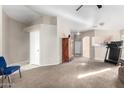 Spacious living room with plush carpeting and neutral paint, offering a versatile living space at 8576 E Jasper St, Gold Canyon, AZ 85118