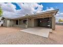 Home's exterior features a spacious covered carport and a well-maintained facade at 10437 E Boulder Dr, Apache Junction, AZ 85120