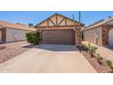 Lovely single-level home boasting desert landscaping and an attached two-car garage at 1247 W Boxelder Cir, Chandler, AZ 85224