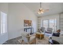Bright living room featuring a ceiling fan and a sliding glass door at 1247 W Boxelder Cir, Chandler, AZ 85224
