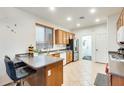 Functional kitchen with wood cabinets, ample counter space and modern appliances at 1633 W Lacewood Pl, Phoenix, AZ 85045