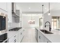 Contemporary kitchen featuring stainless steel appliances, an island, and bright open space at 24152 N 172Nd Ave, Surprise, AZ 85387