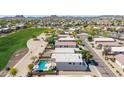 An aerial shot shows the property's backyard pool adjacent to the community golf course at 29051 N Shannon Dr, San Tan Valley, AZ 85143