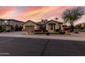 Charming single-story home with a well-manicured lawn and a spacious two-car garage at 3150 E Isaiah Ave, Gilbert, AZ 85298