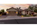 Charming single-story home with a well-manicured lawn and a spacious two-car garage at 3150 E Isaiah Ave, Gilbert, AZ 85298