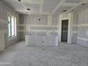 Unfinished room with drywall and a large window, offering a blank canvas for customization and design at 34889 N 3Rd St, Phoenix, AZ 85086