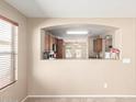 Cozy dining area offers an open view into the kitchen through a pass-through window at 3994 E Maplewood St, Gilbert, AZ 85297