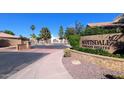 Scottsdale Highland Estates entrance featuring manicured landscaping, stone signage, and secured gated access for residents at 4747 N 84Th Way, Scottsdale, AZ 85251
