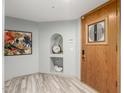 Welcoming foyer features stylish flooring, decorative accents, and a beautiful front door at 4747 N 84Th Way, Scottsdale, AZ 85251