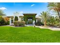 Charming home with a lush green lawn and an inviting entrance covered with climbing vines at 5740 N Casa Blanca Dr, Paradise Valley, AZ 85253