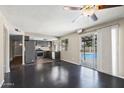 Open-concept living area with the kitchen and dining featuring a view of the beautiful pool at 742 E Garnet Ave, Mesa, AZ 85204