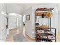 Bright home entryway with tile flooring and a storage shelf for shoes and accessories at 763 E Park Ave, Chandler, AZ 85225