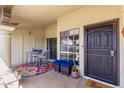 Cozy front porch area with stylish seating, offering a relaxing outdoor space at 8140 N 107Th Ave # 142, Peoria, AZ 85345