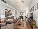 Open-concept living room with hardwood floors and modern decor at 8140 N 107Th Ave # 142, Peoria, AZ 85345