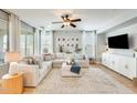 Bright living room boasts a large sectional couch, neutral decor, and abundant natural light at 890 W Zion Pl, Chandler, AZ 85248