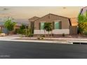 Beautiful single-story home with desert landscaping, accentuating its curb appeal at 17813 W Pinnacle Vista Dr, Surprise, AZ 85387