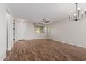 Bright living room featuring wood-look floors, a ceiling fan, neutral paint and ample natural light at 20733 W Alsap Rd, Buckeye, AZ 85396