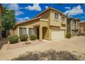 Two story home featuring neutral paint, an attached two car garage, and well maintained landscaping at 21840 N 41St St, Phoenix, AZ 85050
