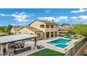 A luxurious backyard featuring a pool, spa, covered patio, and meticulously landscaped grounds, perfect for entertaining at 30129 N 52Nd Pl, Cave Creek, AZ 85331