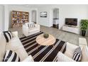 Bright living room featuring contemporary decor, stylish furniture, and an open layout for comfortable living at 3013 S 102Nd Ln, Tolleson, AZ 85353