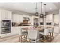 Bright kitchen features granite counters, stainless steel appliances and a large island with seating at 3751 E Zachary Dr, Phoenix, AZ 85050
