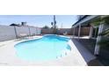 Backyard pool and patio area featuring a refreshing pool and seating area for outdoor relaxation at 5007 N 71St Dr, Glendale, AZ 85303