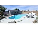Backyard pool features a refreshing pool, outdoor seating area, a stucco fireplace and low maintenance yard at 5007 N 71St Dr, Glendale, AZ 85303