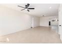 Open-concept living room featuring recessed lighting and neutral tile flooring throughout at 6823 W Coolidge St, Phoenix, AZ 85033