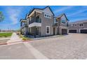 Stunning two-story home with a balcony, three-car garage and beautiful landscaping at 11300 N Casa Dega Dr # 1027, Surprise, AZ 85388