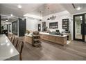 Bright market area featuring a coffee bar, light wood floors, and white brick walls at 11300 N Casa Dega Dr # 1027, Surprise, AZ 85388