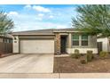 Charming single-story home with a well-maintained front yard and a two-car garage at 12374 W Locust Ln, Avondale, AZ 85323