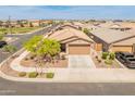 This cozy home sits on a corner lot, showing the surrounding neighborhood and nearby streets at 14166 W Valentine St, Surprise, AZ 85379