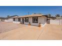 Inviting single-story home with a spacious driveway and quaint front porch at 2068 E Orange St, Tempe, AZ 85281