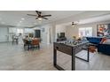 Open-concept living room featuring tiled floors, stylish decor, and modern furnishings at 2068 E Orange St, Tempe, AZ 85281