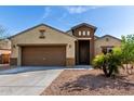 Charming single-story home with a two-car garage and well-maintained landscaping at 23789 W Chipman Rd, Buckeye, AZ 85326