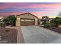 Attractive single-story house with a well-kept lawn and a two-car garage at 27949 N 130Th Ave, Peoria, AZ 85383