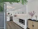 This bright kitchen has white cabinets and quartz countertops at 3401 N 37 St # 14, Phoenix, AZ 85018