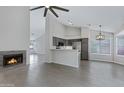 Open-concept living space with a fireplace, tile flooring, and gray accents at 4031 N Ranier --, Mesa, AZ 85215