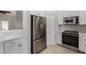 Updated kitchen with stainless steel appliances and storage at 4525 E Desert View Dr, Phoenix, AZ 85044