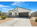 Neat single-story home featuring a two-car garage and low maintenance landscaping at 5237 W Alta Mesa Ave, Laveen, AZ 85339