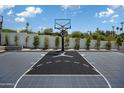 Inviting basketball court featuring Jordan logo and well-maintained landscaping for premium outdoor fun at 5814 E Camelback Rd, Phoenix, AZ 85018