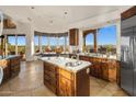 Spacious kitchen with stainless appliances and picturesque views from every window at 6001 E Restin Rd, Cave Creek, AZ 85331