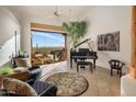 Comfortable living room with flagstone floors and beautiful mountain view at 6001 E Restin Rd, Cave Creek, AZ 85331