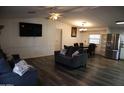 Inviting living room featuring modern furniture, stainless steel appliances, and hardwood floors at 625 W Mckellips Rd # 279, Mesa, AZ 85201